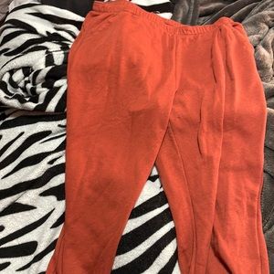 Orange sweat pants. Some piling